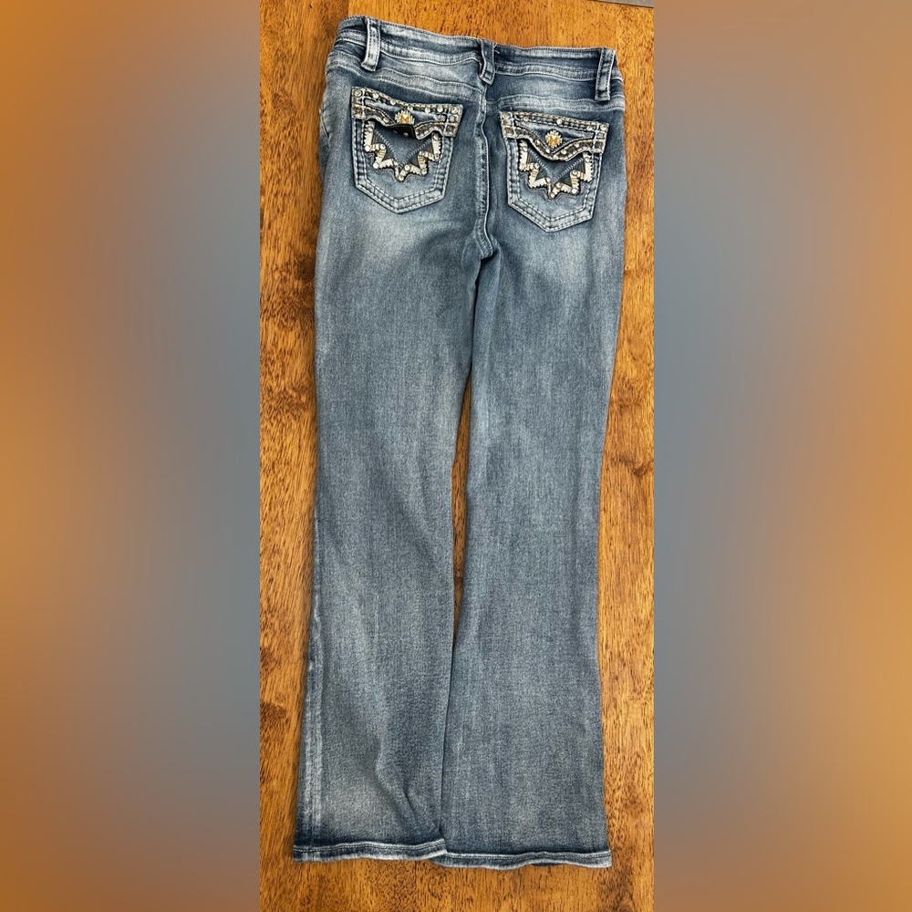 Stylish Blue Flare Jeans with Embellished Pockets